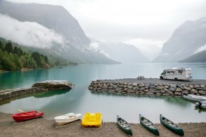 Boaks by Lake in Mountains